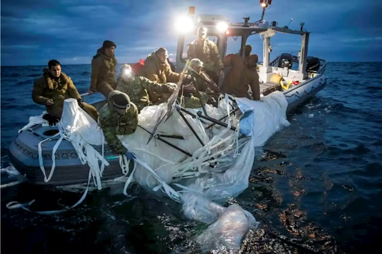 Navy divers begin pulling up Chinese spy balloon debris