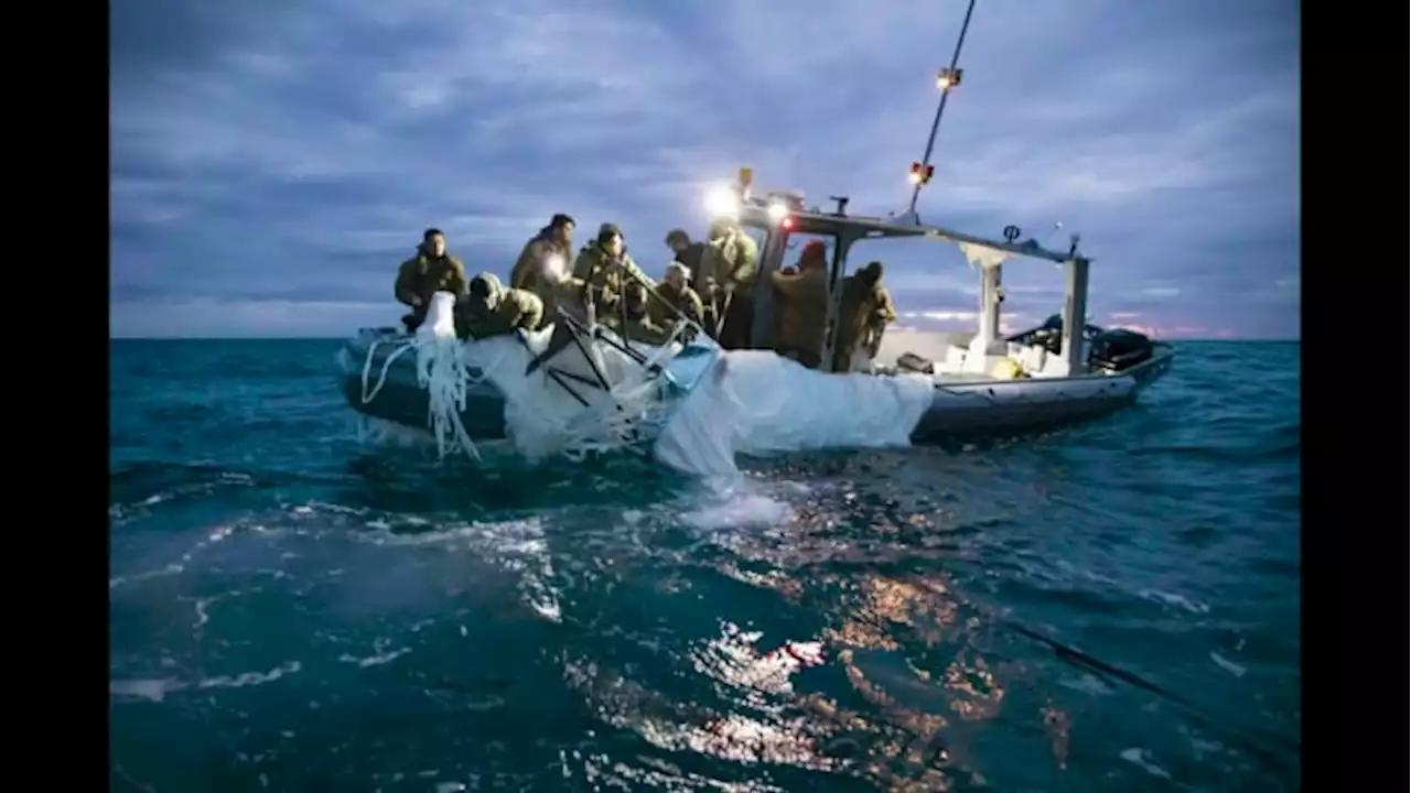 Navy divers begin pulling up Chinese spy balloon debris