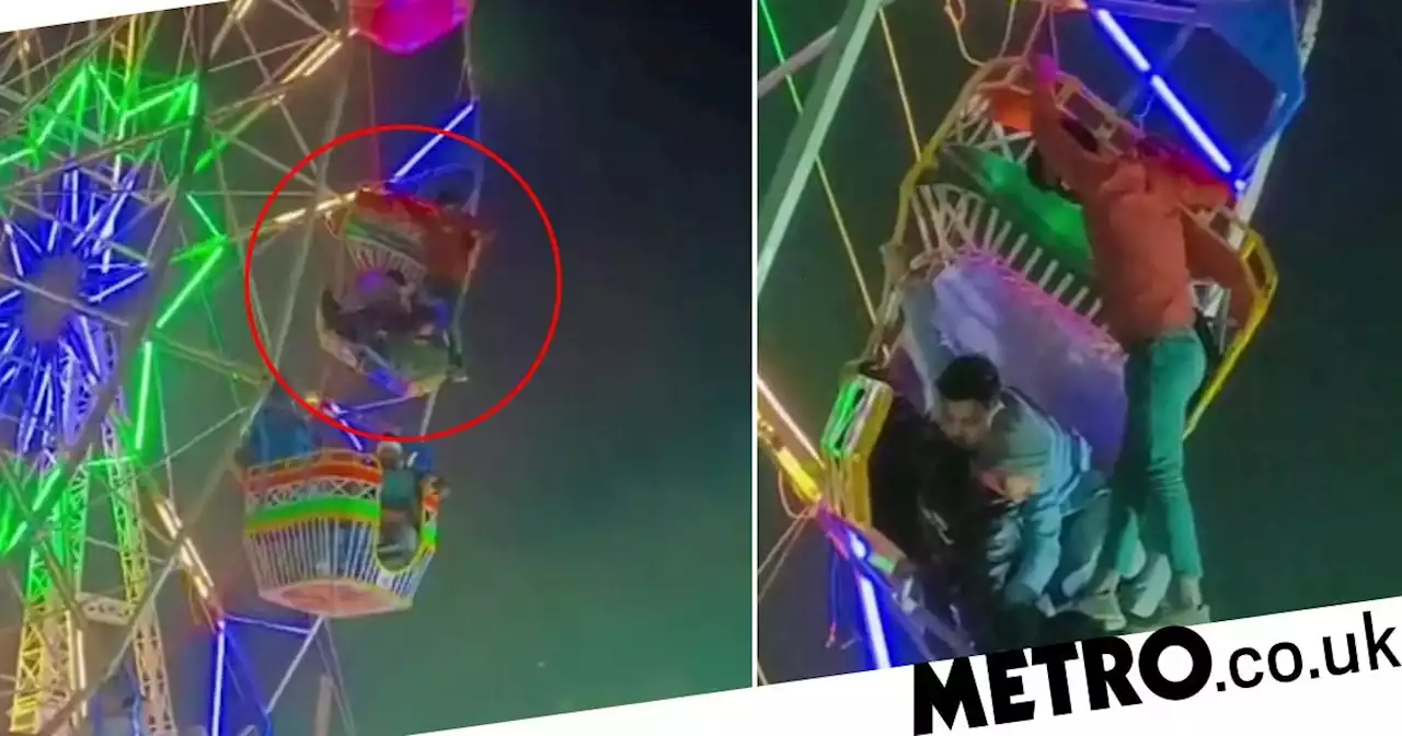 Ferris wheel malfunction leaves riders hanging onto their seats upside down