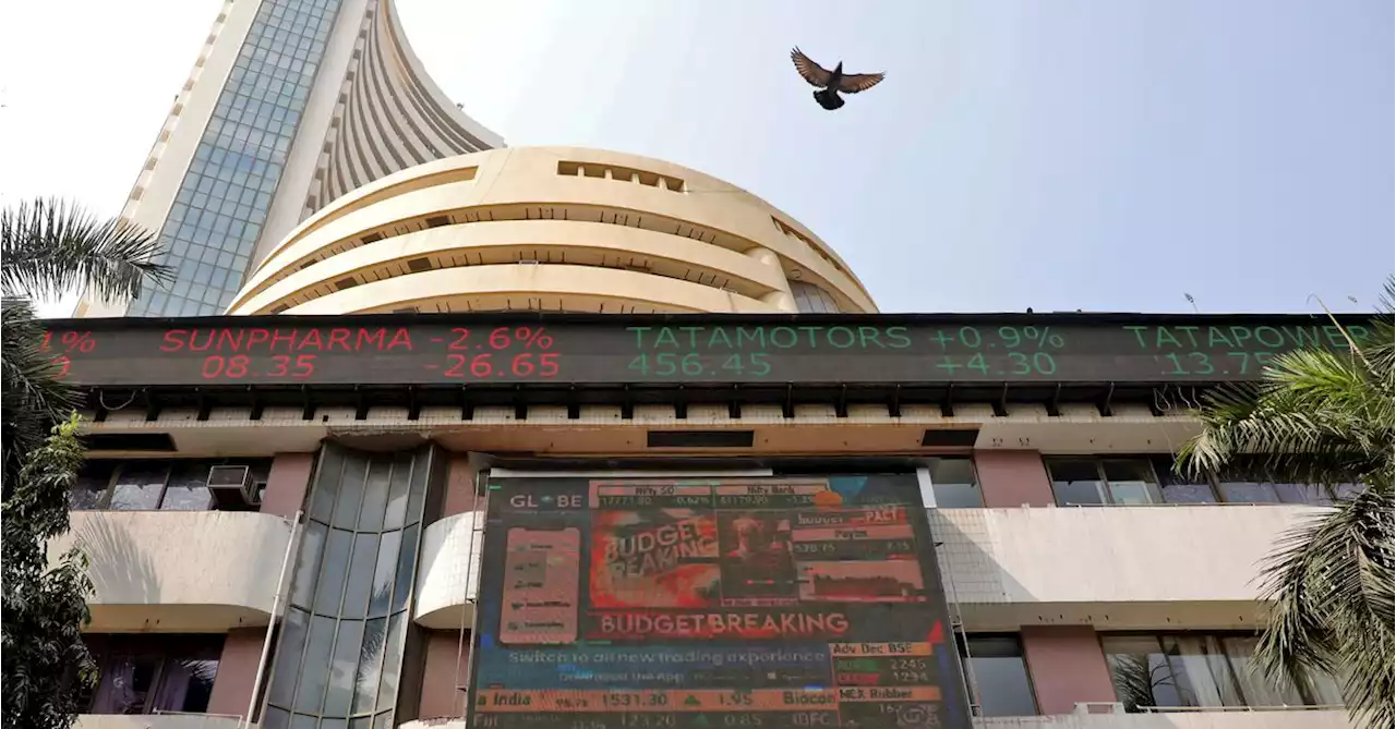 Indian shares rise after RBI rate hike; Adani stocks jump