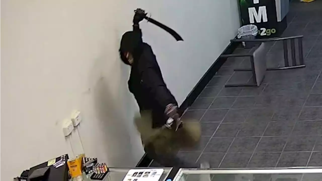 CCTV captures terrifying moment man tries to rob Qld business with machete