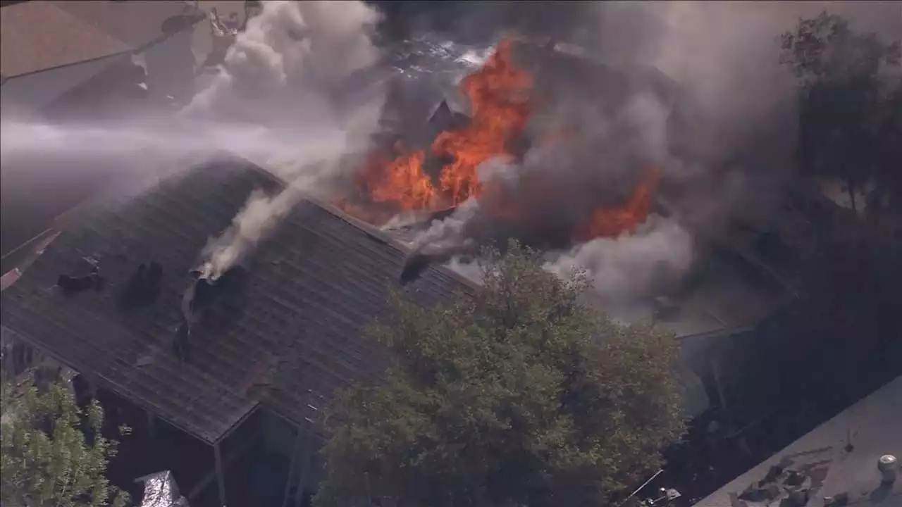 Crews battle house fire in Phoenix