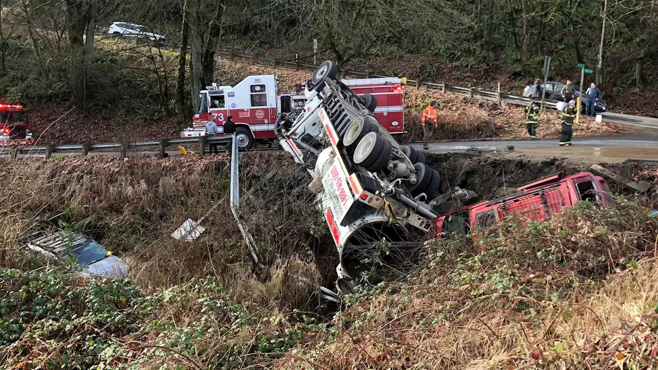 Incident involving commercial truck and two vehicles over embankment near Kent