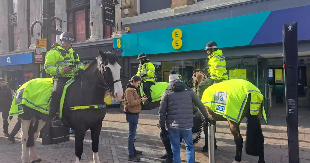 Crowd brand mounted police a 'joke' after surrounding man on bench