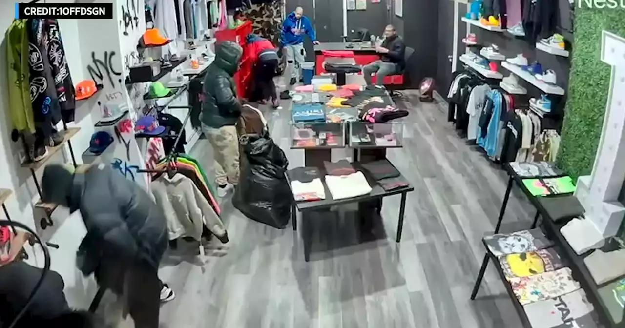 Exclusive: Surveillance video shows armed robbers taking over $80K worth of merchandise from Queens clothing store