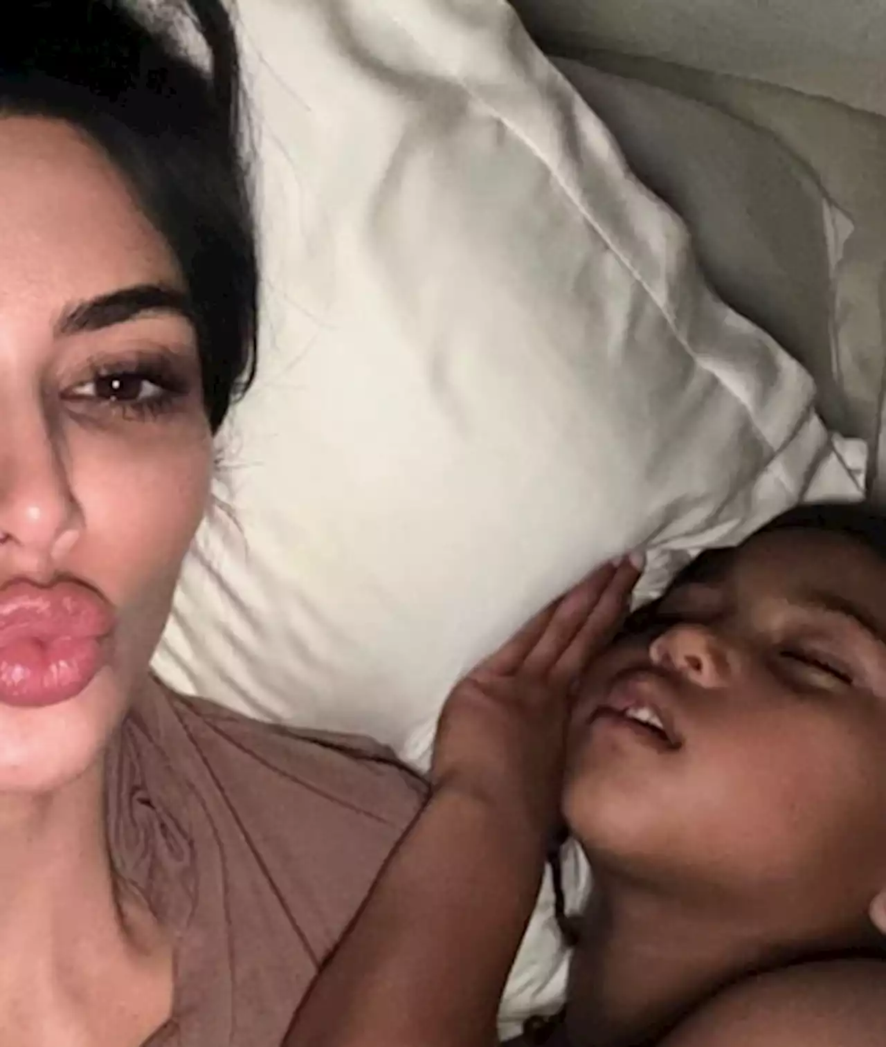 Kim Kardashian’s Sweet Cuddle Session With Son Saint Gets Interrupted By His Reflexive Punch