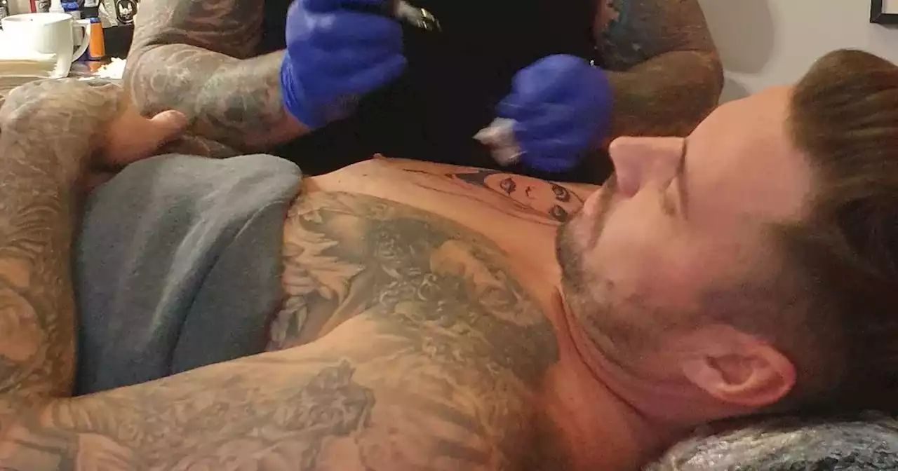 Katie Price's ex Carl Woods gets a third tattoo of her making rude gesture