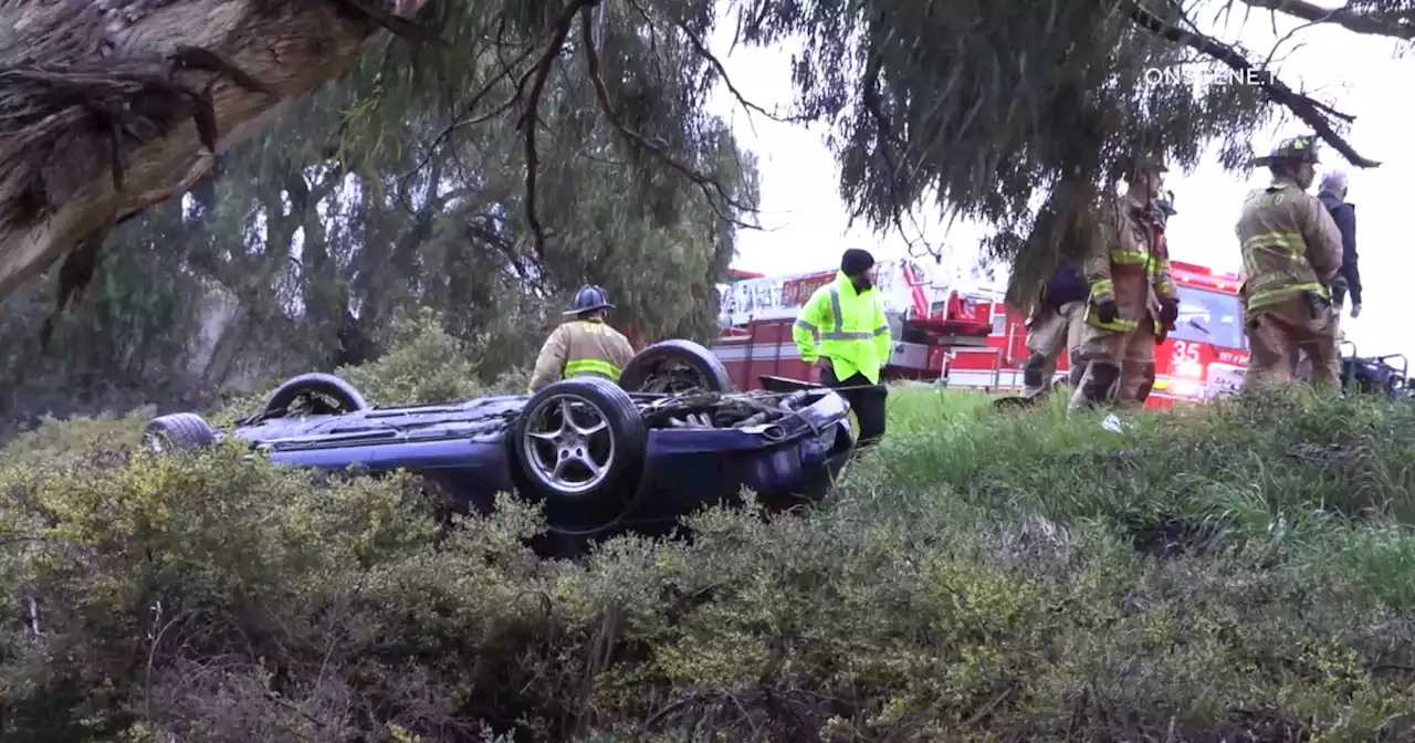 Driver extricated from overturned car after crashing off I-5 in La Jolla