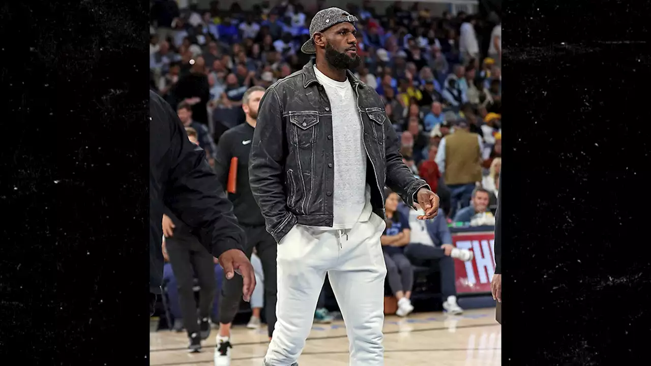 LeBron James Wears Huge Walking Boot To Lakers Game, Season In Jeopardy