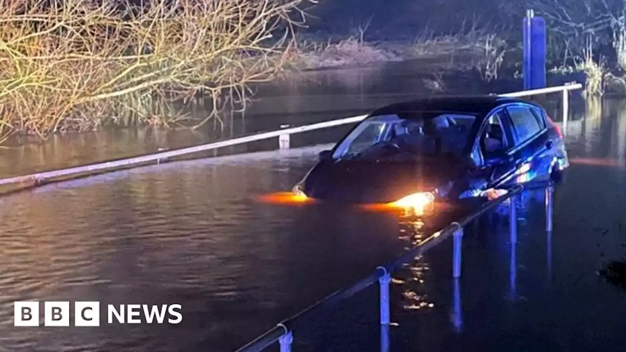 Woman rescued from car submerged in Essex flood water