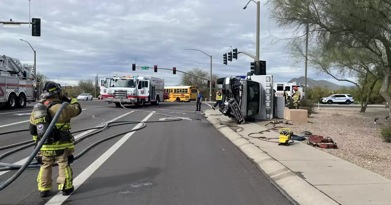 Four people hospitalized after crash between ambulance and car