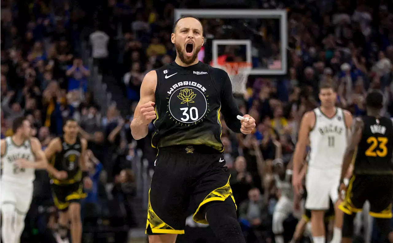 Stephen Curry's late burst rallies Warriors past Bucks in OT