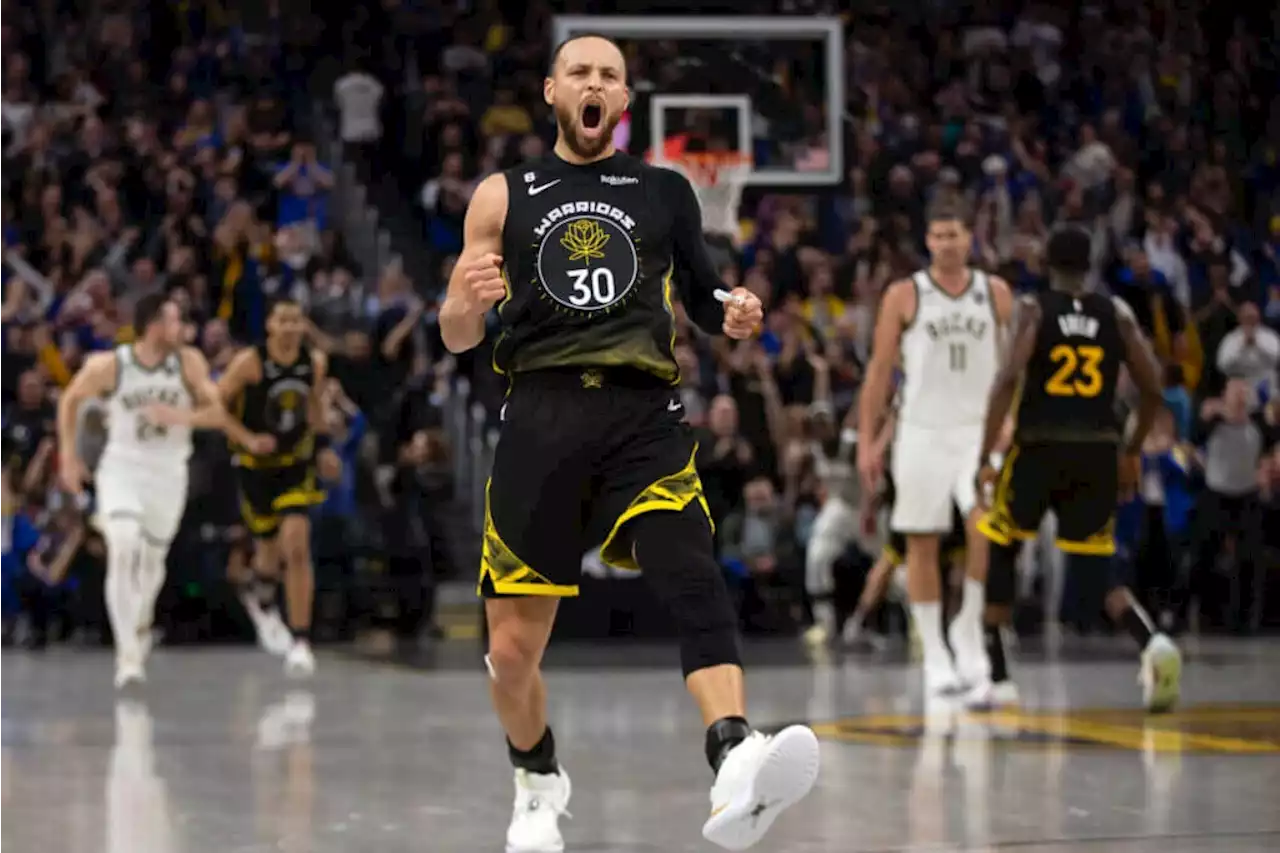 Steph Curry's late scoring spree saves Warriors in OT win over Bucks