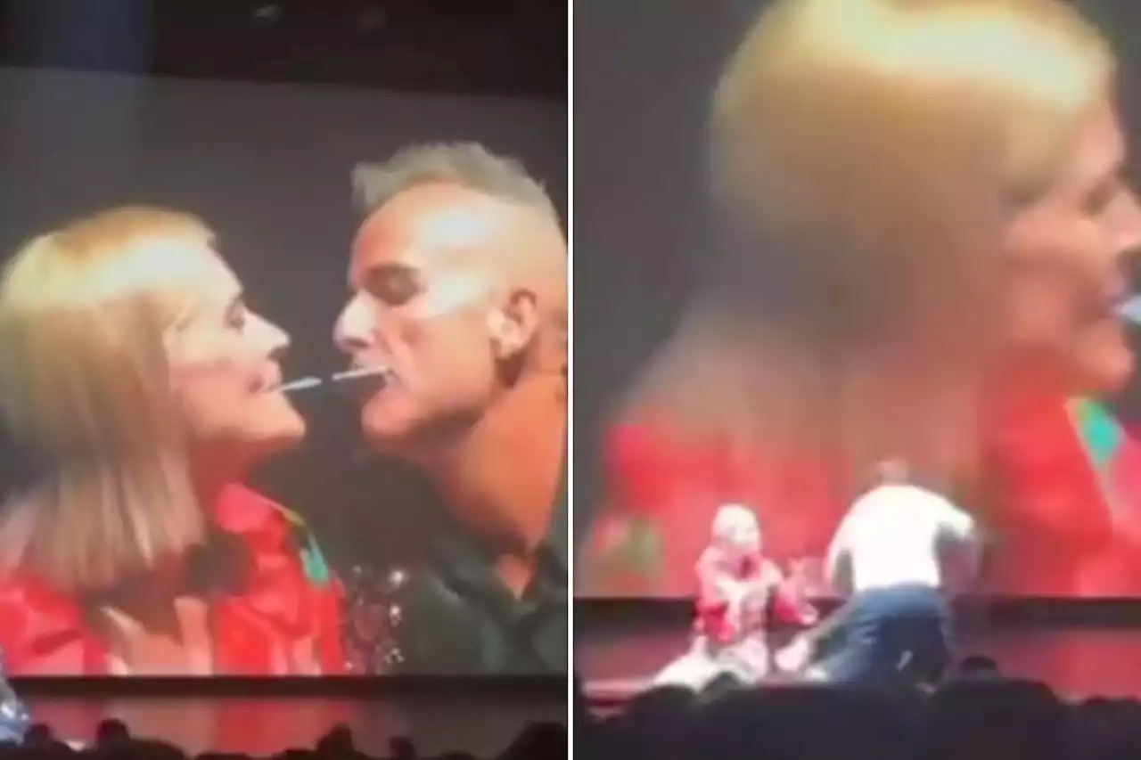 Moment man tackles magician performing intimate mouth trick with 'wife' on stage