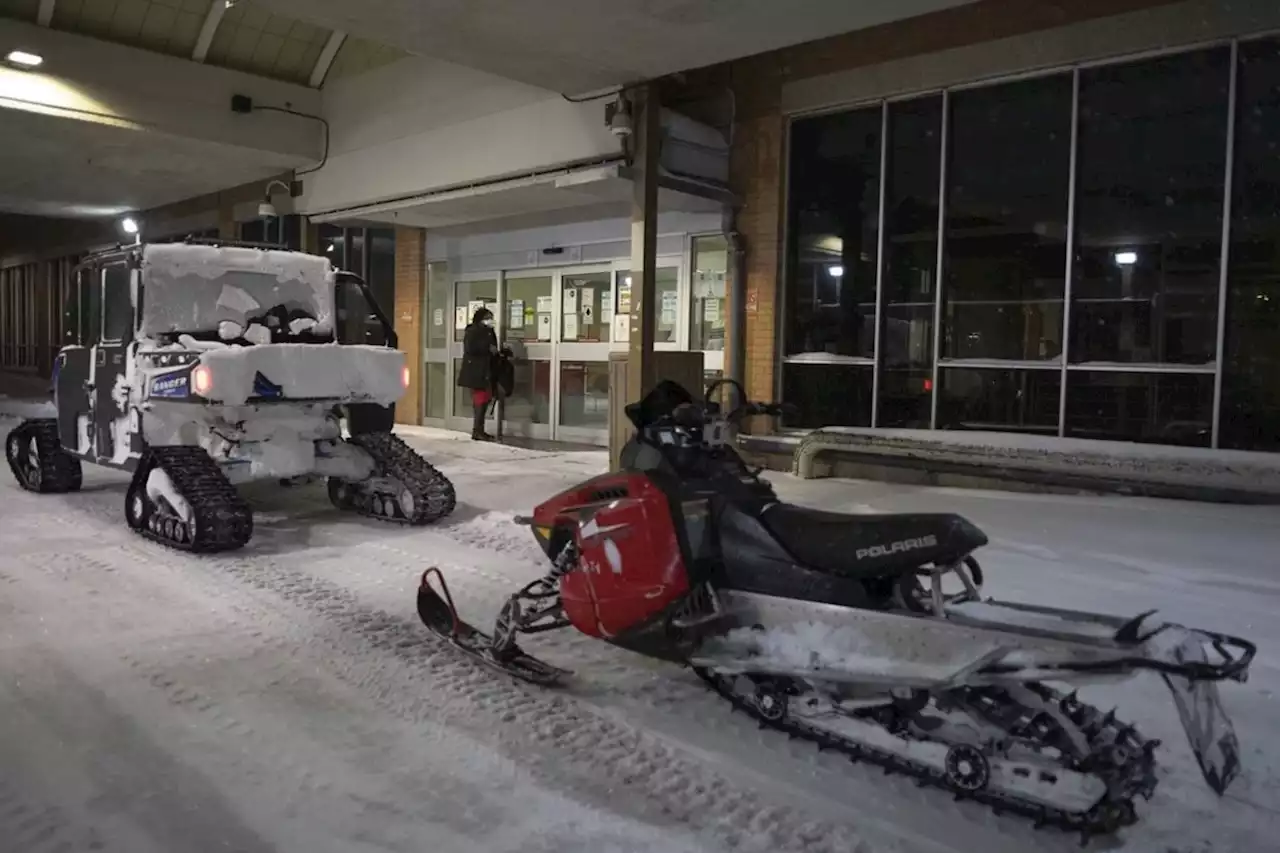 B.C. conservation officers on snowmobiles rescue man stuck in snowstorm