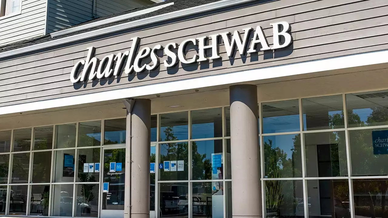 Charles Schwab shares trim losses as CFO defends firm