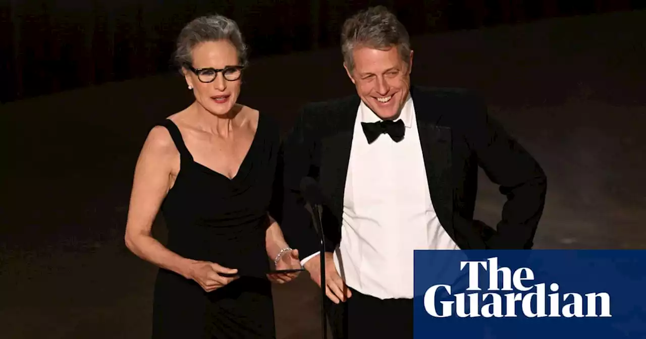 Hugh Grant gets Oscars off to awkward start on red carpet – before comparing himself to a scrotum on stage