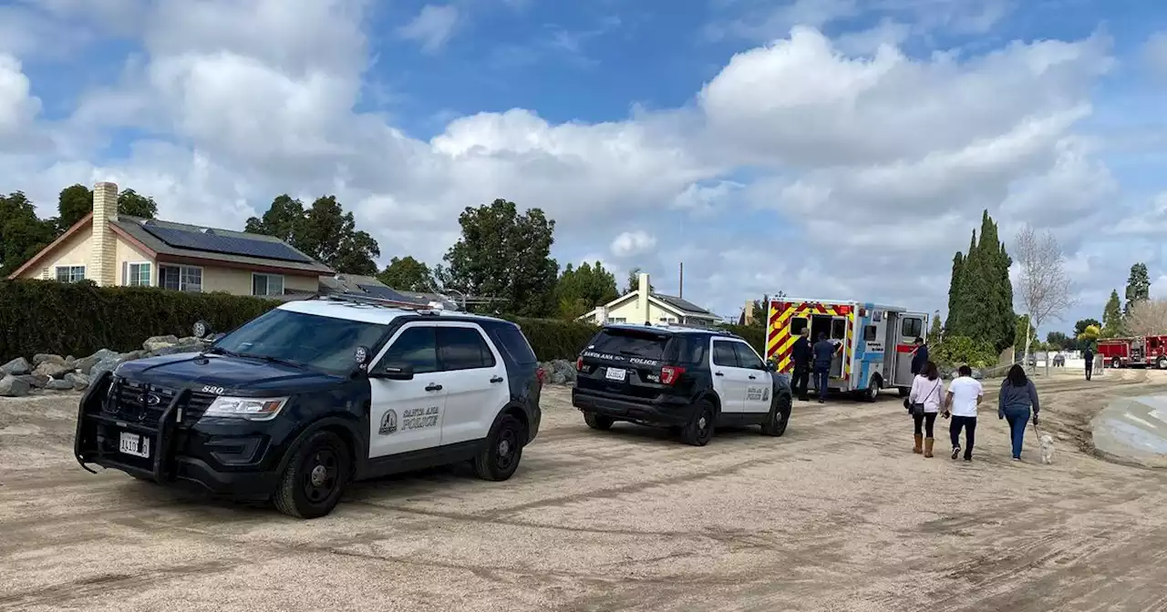 Little boy rescued after being swept away in rain-flooded Santa Ana River