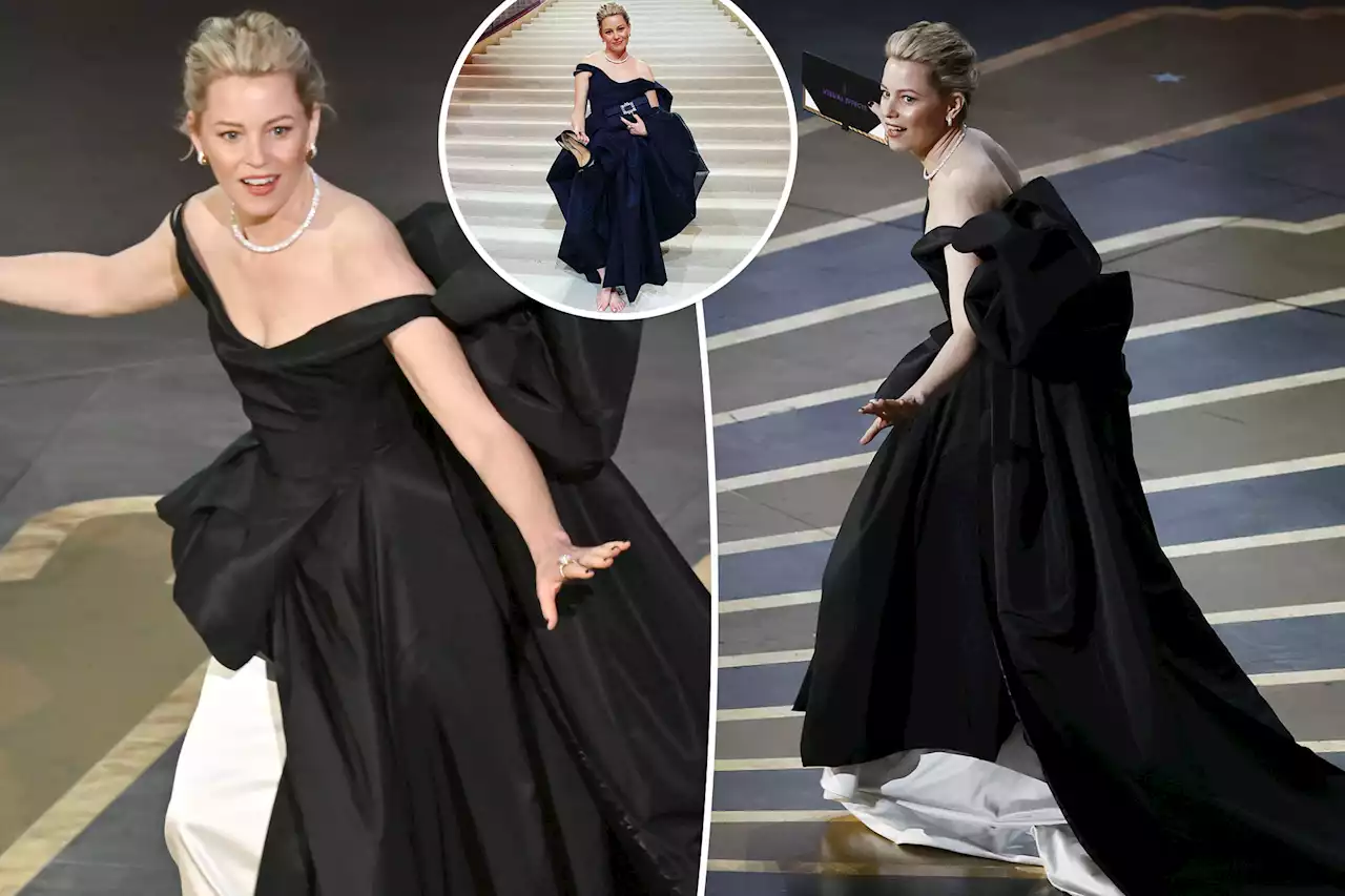 Elizabeth Banks ditches her shoes after almost tripping during Oscars