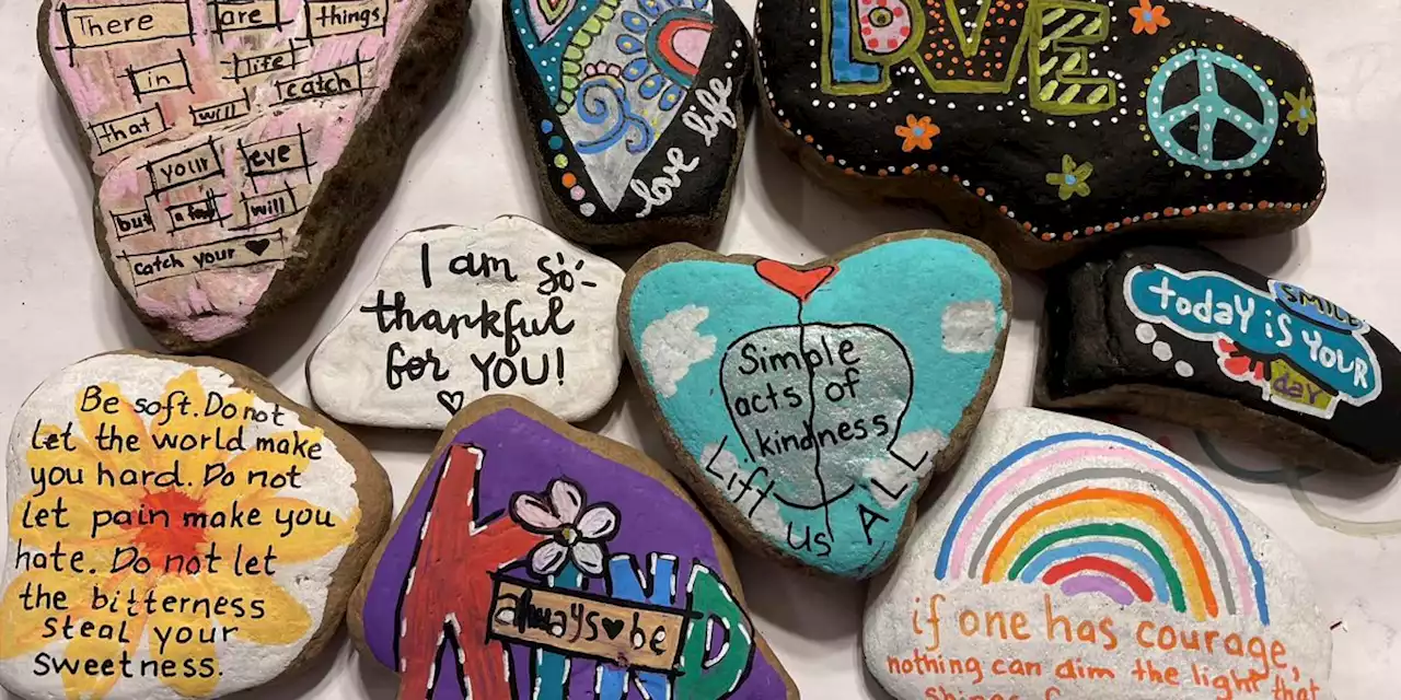 Painted rocks scattered across the globe to spark joy