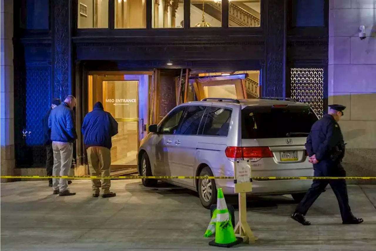 Minivan crashes through the front of Philadelphia police headquarters