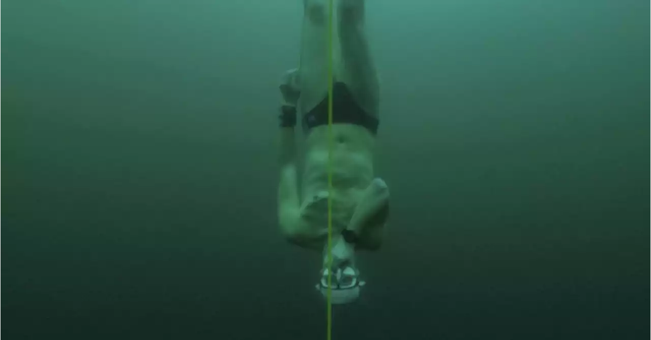 Free-diver plunges to record depth beneath frozen Swiss lake