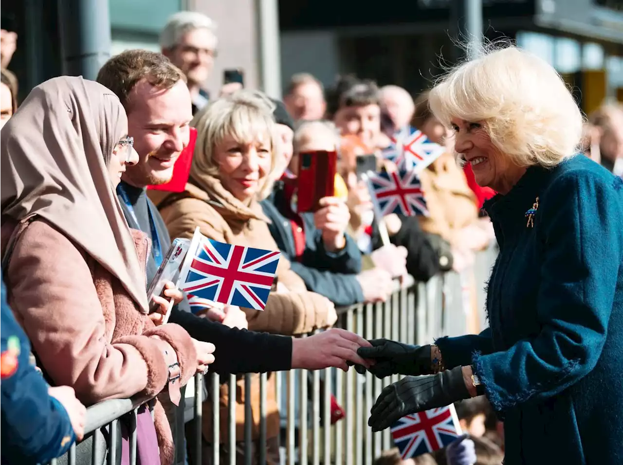 Flags wave and cheers go up as crowds welcome Queen Consort to Telford