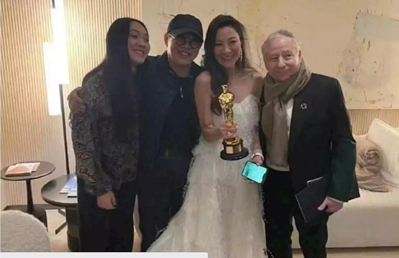 Jet Li congratulates Michelle Yeoh on her Best Actress win at the Oscars