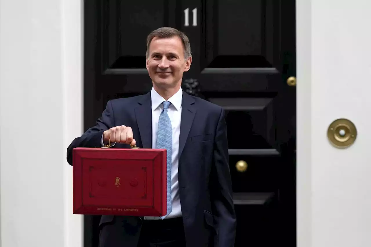 British finance minister unveils budget, forecasts no recession this year