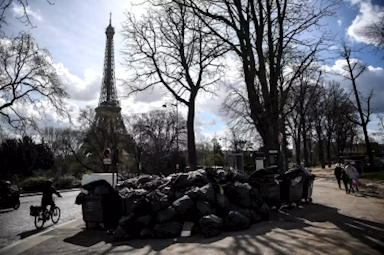 Garbage mounts in Paris as Macron eyes French pension reform vote