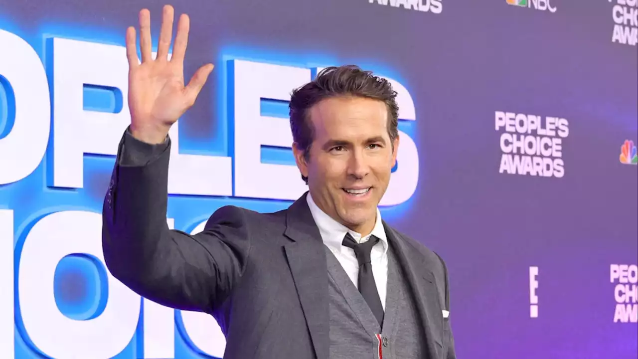 Ryan Reynolds hops out of the Spirited outfit and into his bag