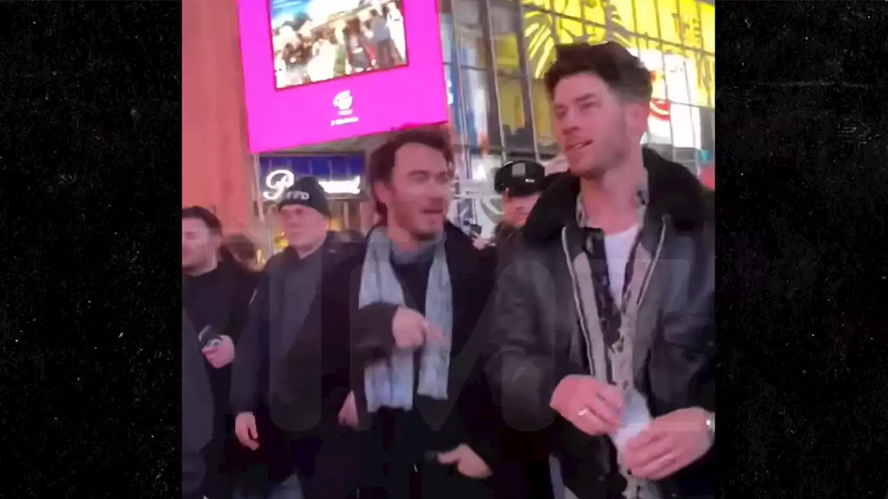 Jonas Brothers Swarmed by Fans in Time Square