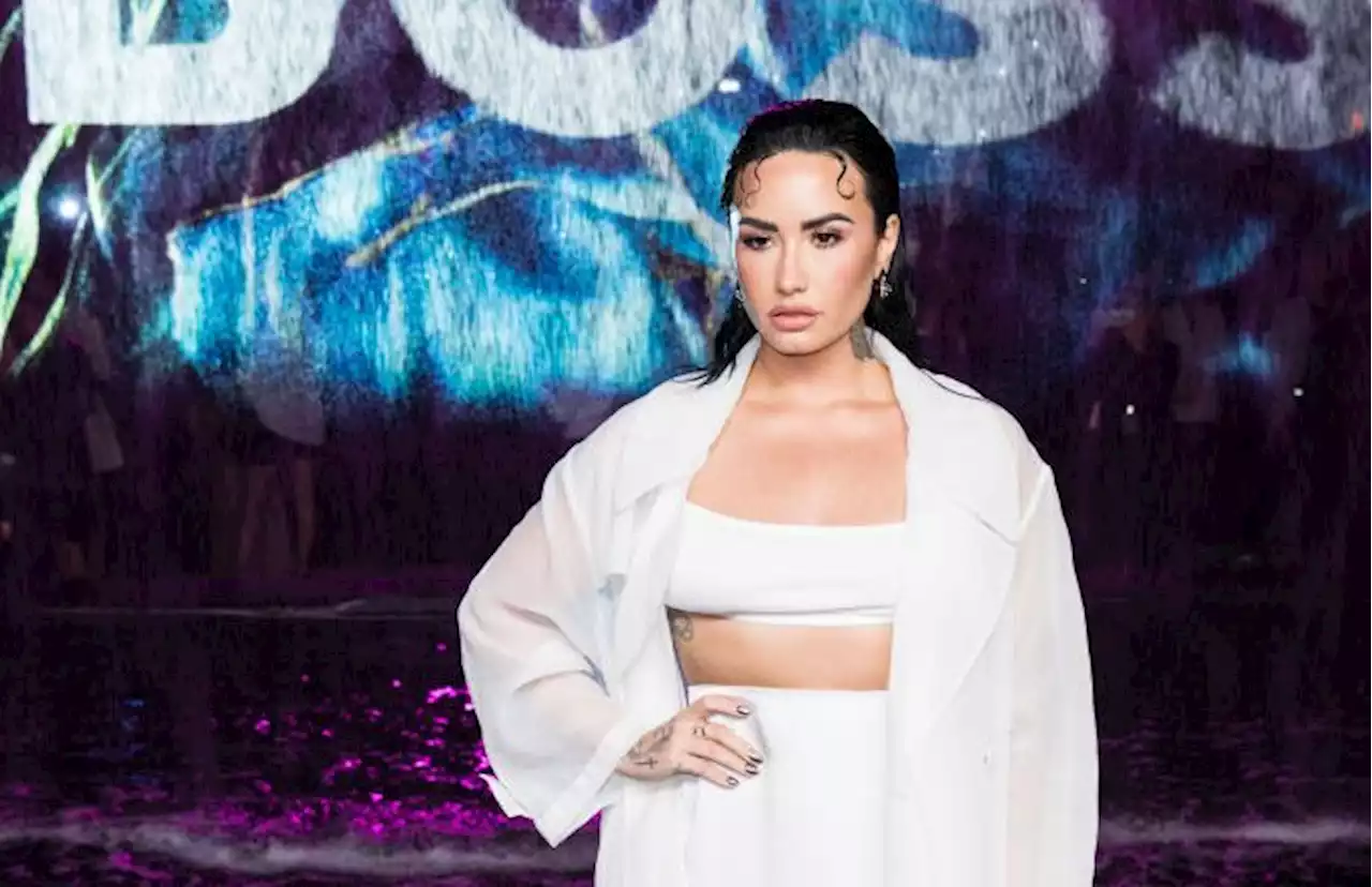 Demi Lovato Flows in Sheer Coat and White Bralette at Boss’ Spring 2023 Miami Show