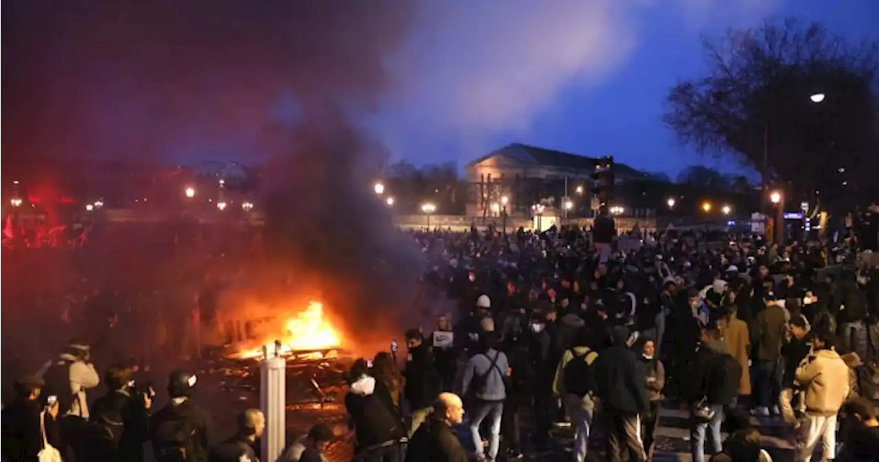 IN PHOTOS: Fiery protests erupt across France after Macron pushes pension reform - National | Globalnews.ca