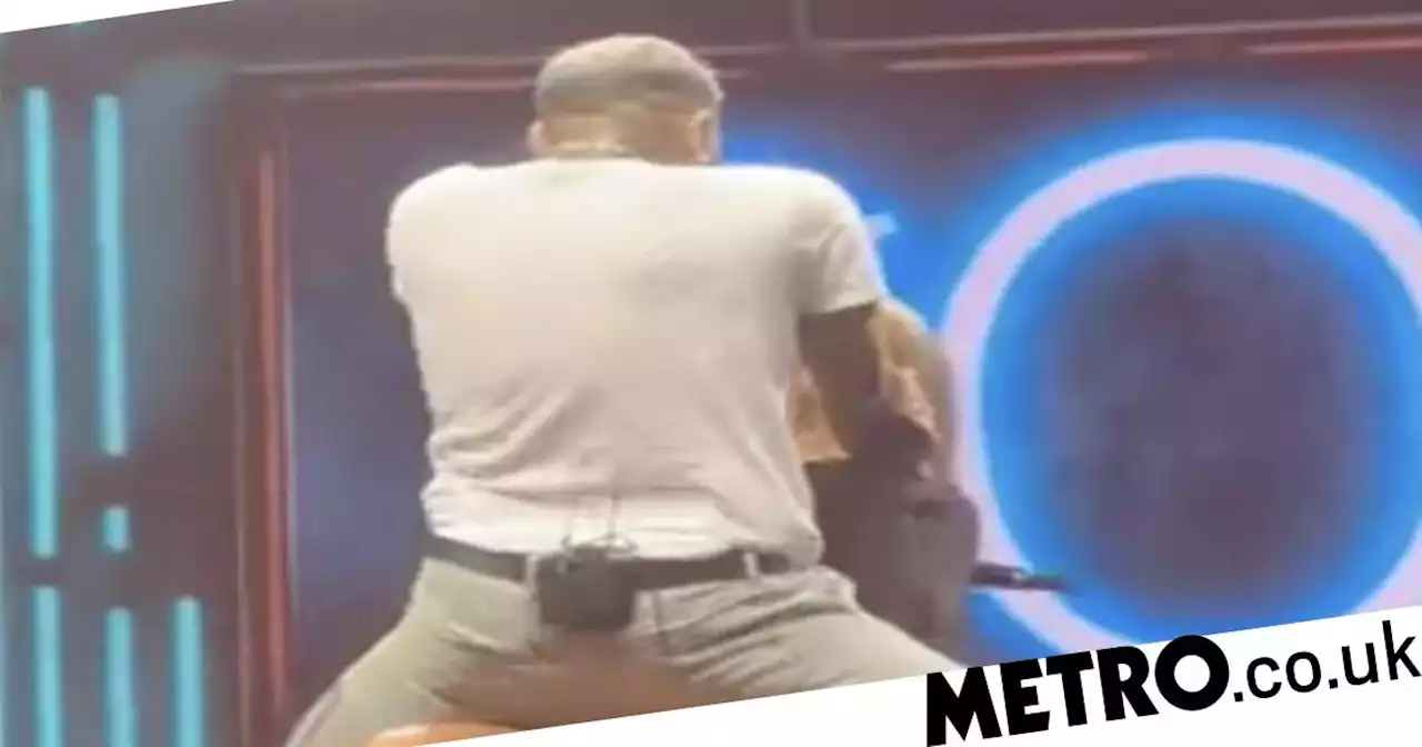 Chris Brown holds love Island star by the throat as he serenades her on stage