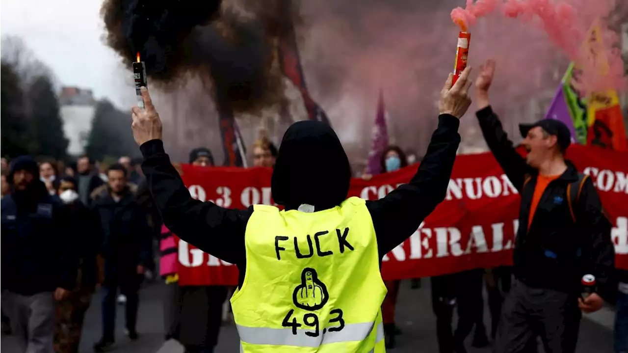 Fiery Protests Erupt Across Paris as Macron Tries to Force Pension Changes