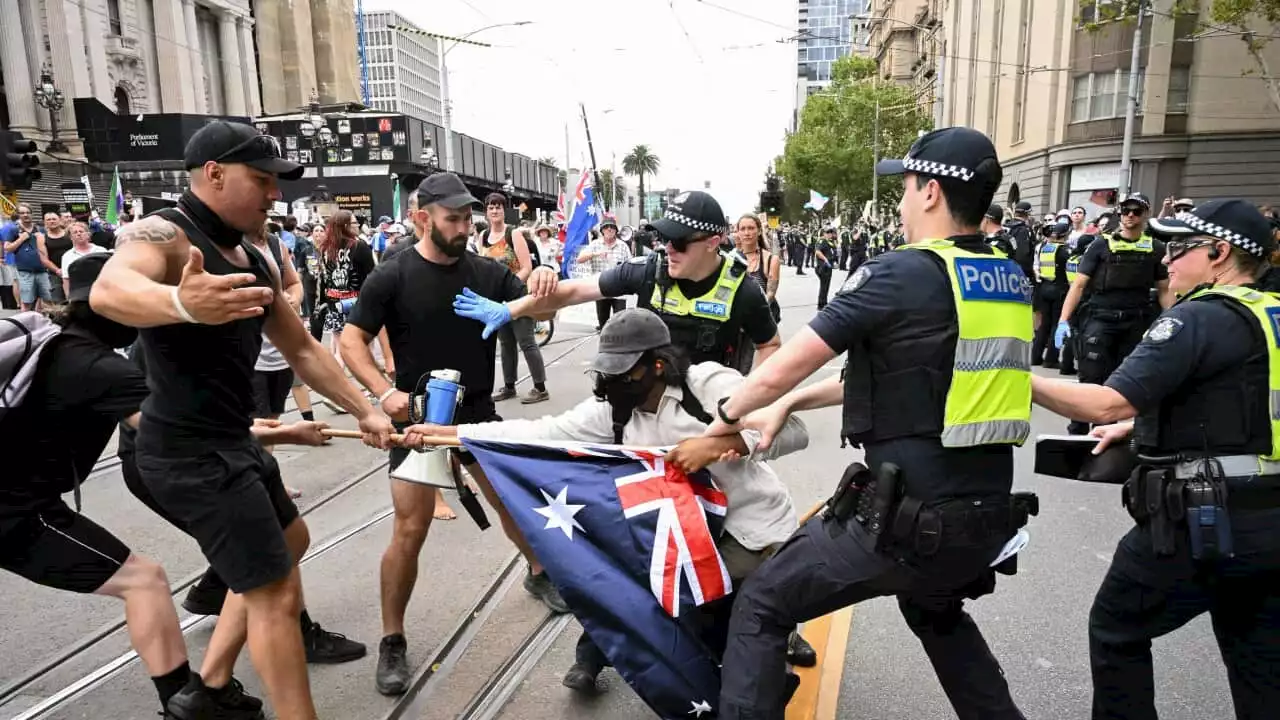 Nazi salutes performed on steps of Victorian parliament as protesters clash over trans rights