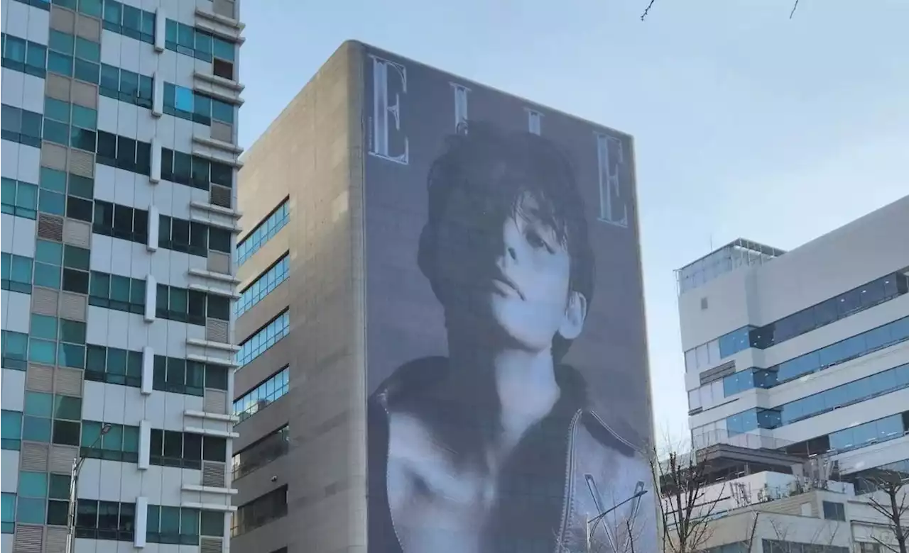 BTS's V graces an entire side of ELLE Korea's company building with his celebrated cover | allkpop