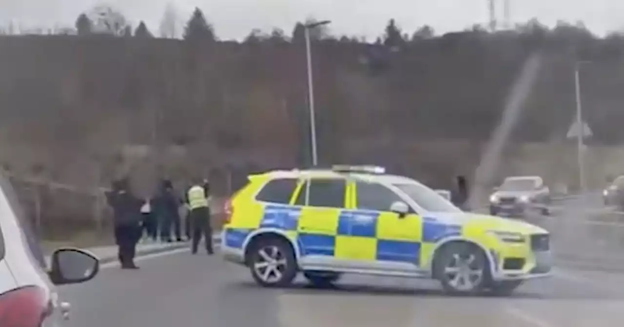 Heavily armed police pull over car 'after chase' miles from Greenock shooting