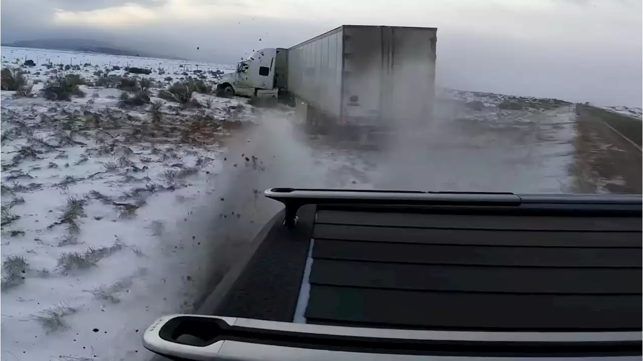 Watch a Rivian R1T Yank a Stuck Semi From Ditch