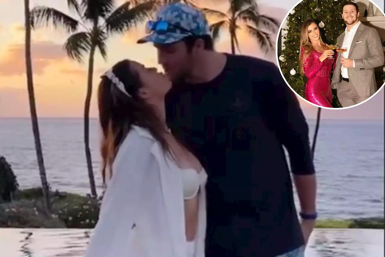 Josh Allen and girlfriend Brittany Williams kiss during offseason getaway