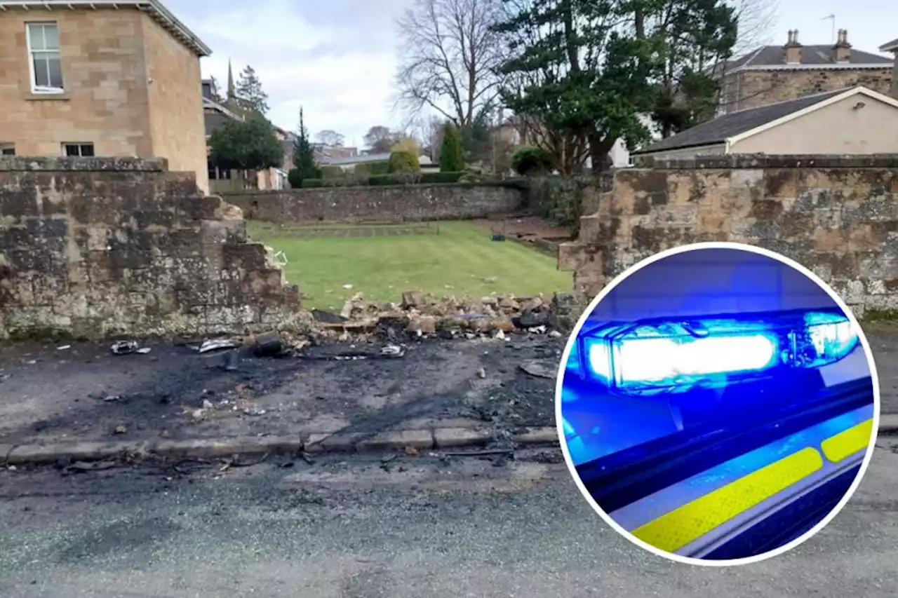 Van crashes into building and bursts into flames as cops launch probe