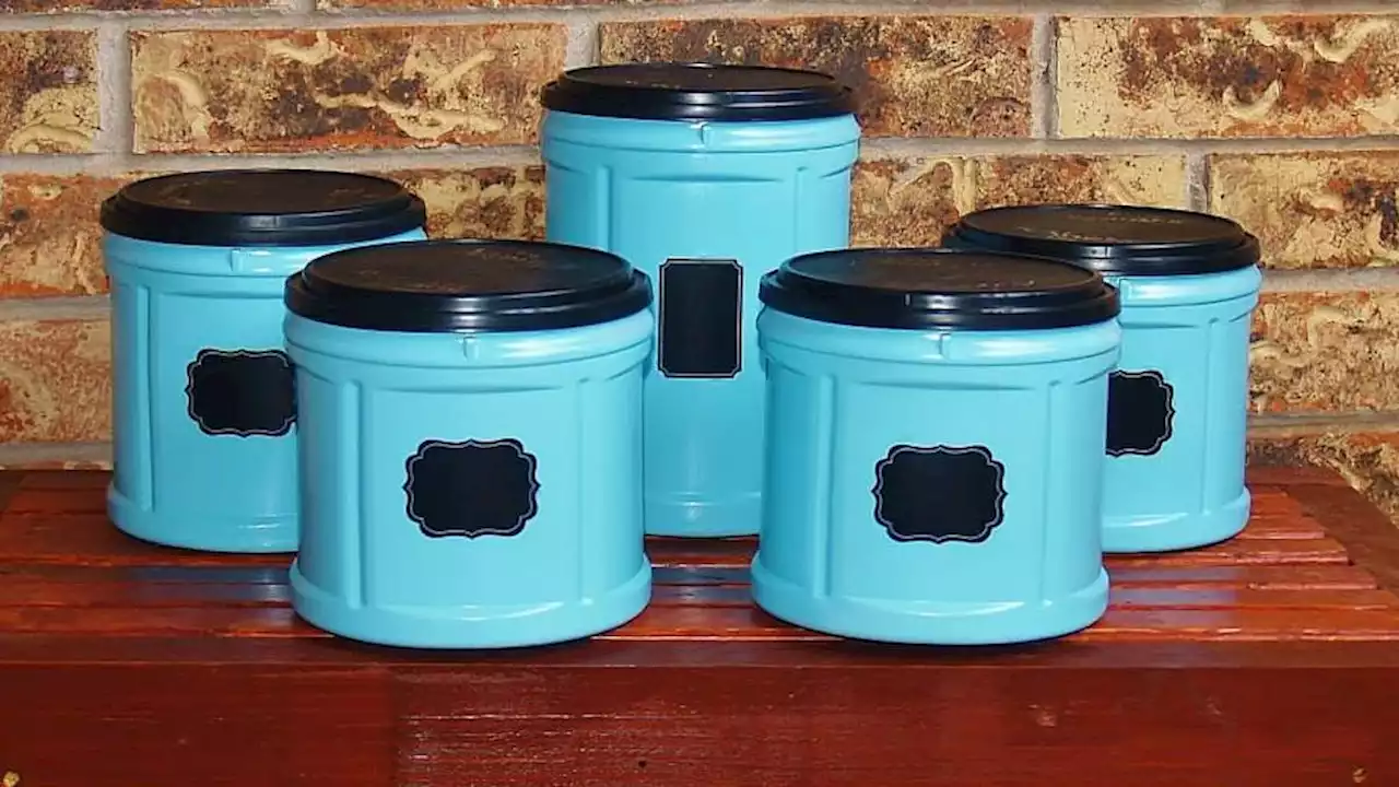 Recycle coffee canisters into cute, sealing kitchen storage containers with just a few supplies