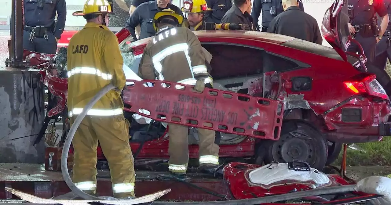 Suspect who drove stolen car at officer is hospitalized after crash hours later, LAPD says