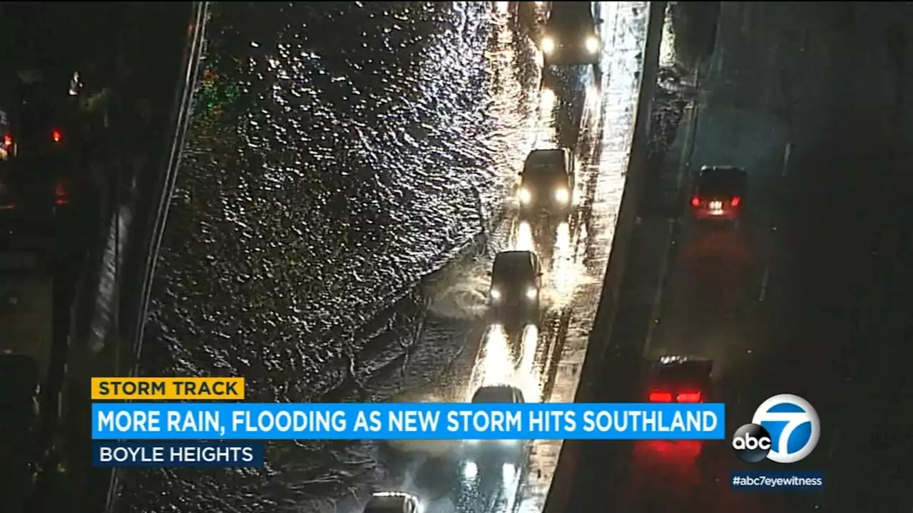 Rain waters flood part of 101 Freeway as atmospheric river causes hazardous driving conditions