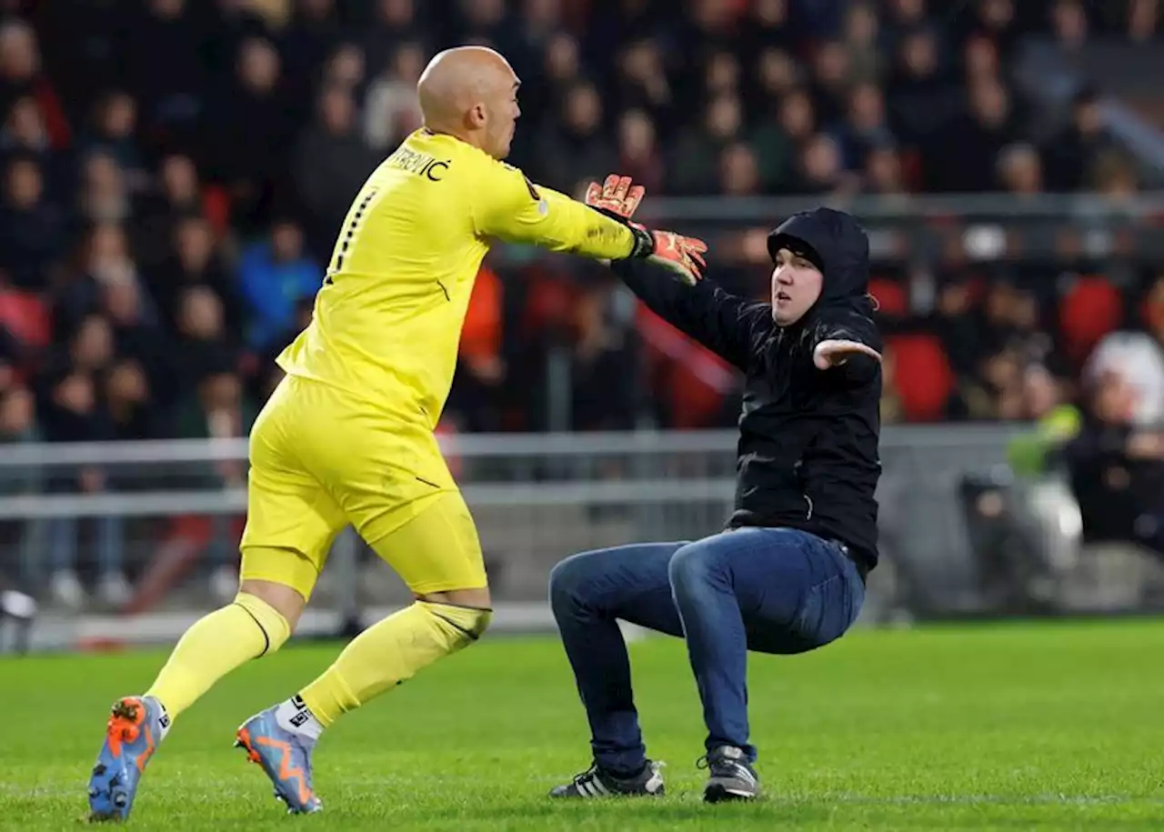 Soccer-Man who attacked Sevilla keeper handed 40-year stadium ban by PSV