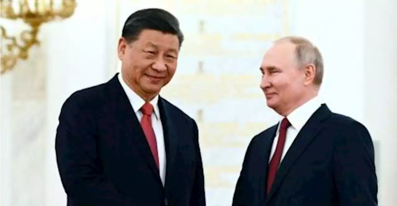 Xi calls Russia ties priority on Moscow trip