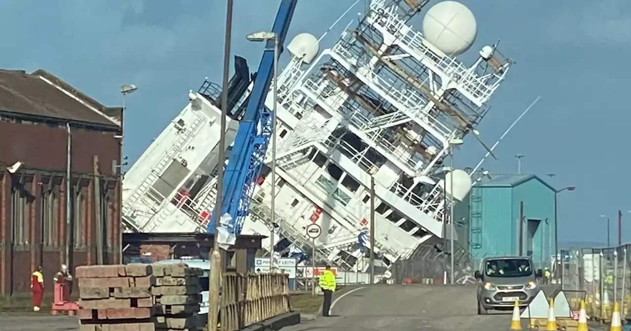 Large boat tips onto side at Edinburgh docks as emergency crews race to scene