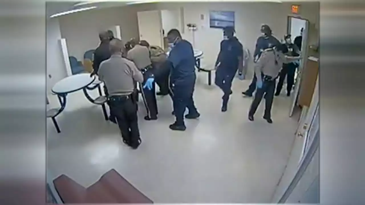 Video shows US police piling on man who died at mental hospital