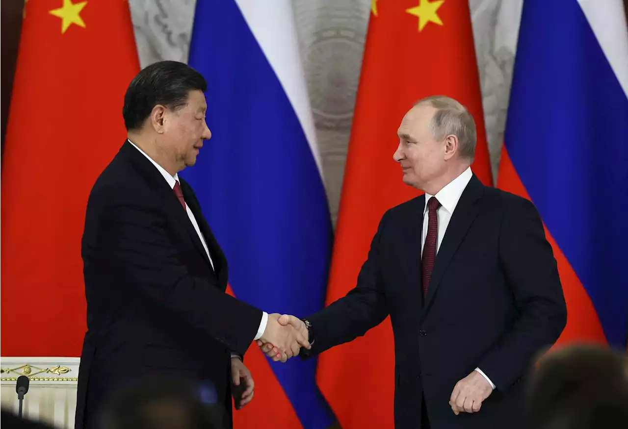 Xi's comments to Putin about 'driving changes together' caught on video